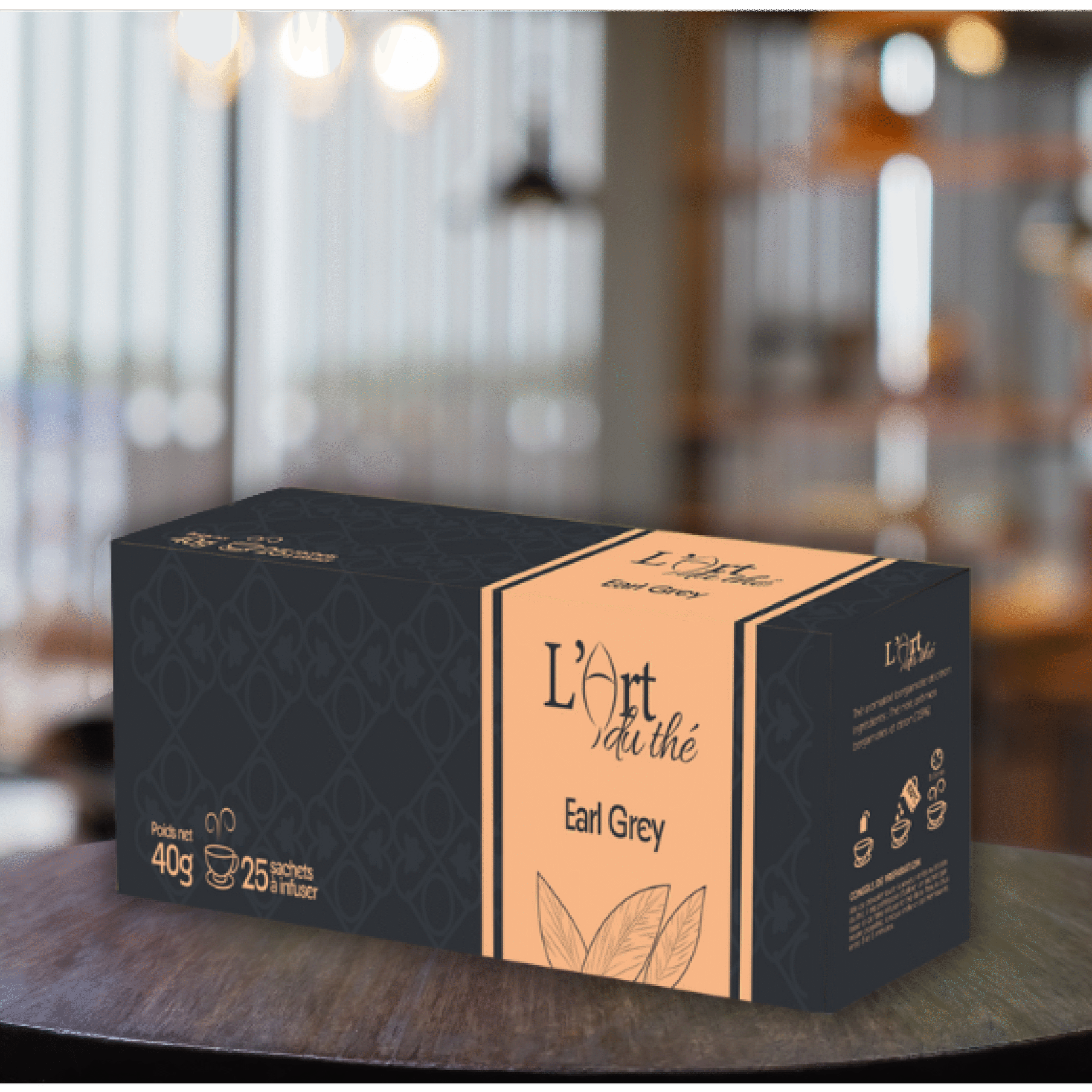 Boîte de thé noir Earl Grey de la marque "L’Art du thé", avec un design élégant noir et saumon, contenant 25 sachets pour un poids net de 40g. L'emballage affiche des feuilles de thé stylisées et des instructions de préparation sur le côté.
